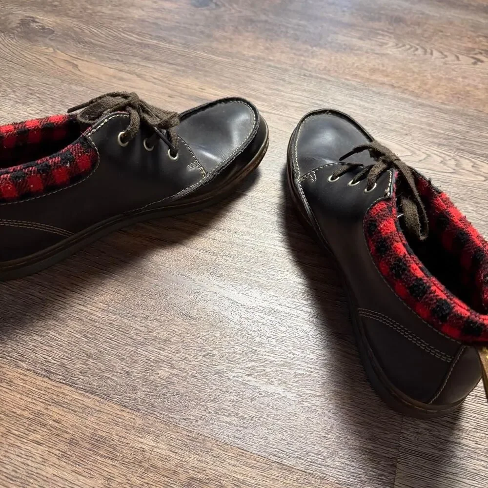 Dr. Martens black leather lace up boots with red/black plaid lining, size US 10